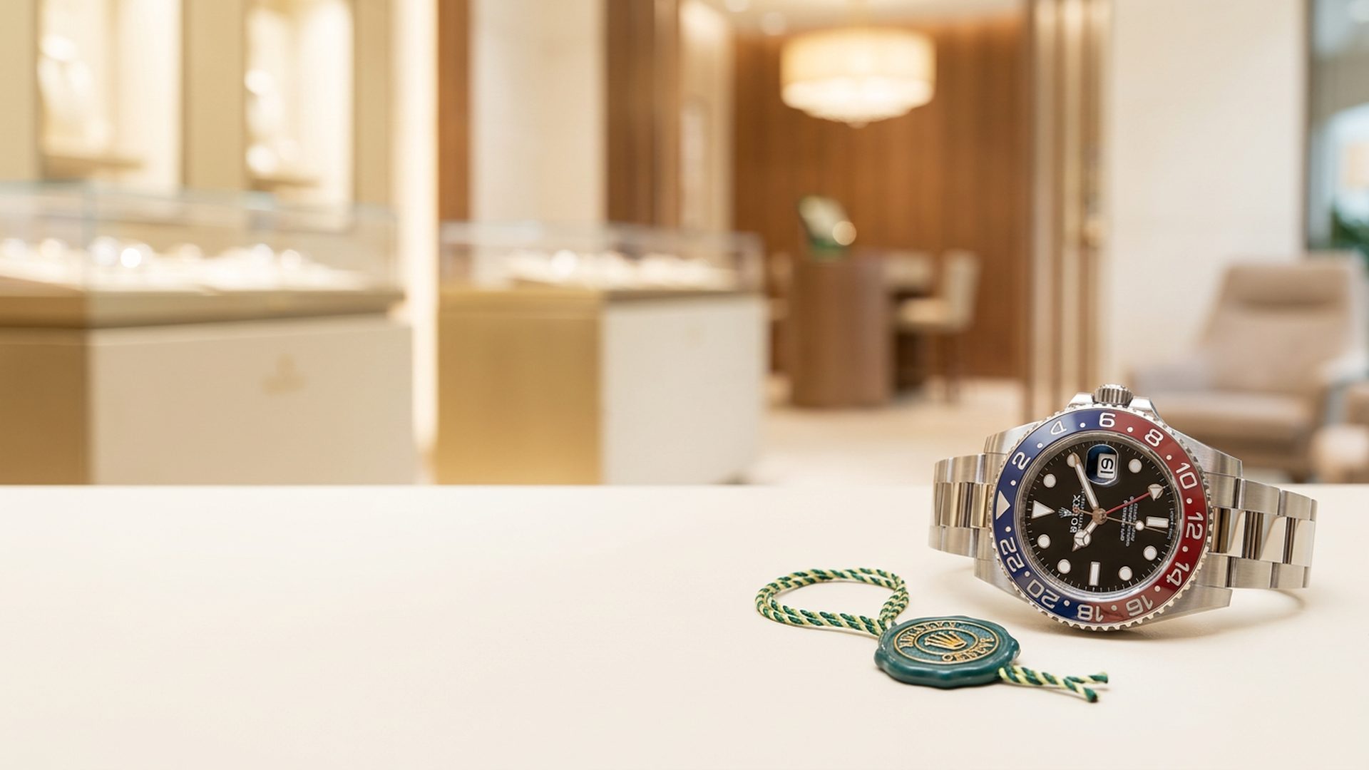 Rolex GMT-Master II Pepsi in a warm-lit boutique setting